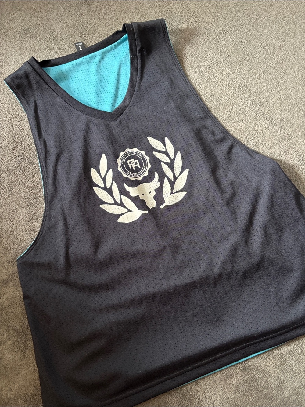 Under Armour Black Tank Jersey with Teal Lining and Metallic Crest